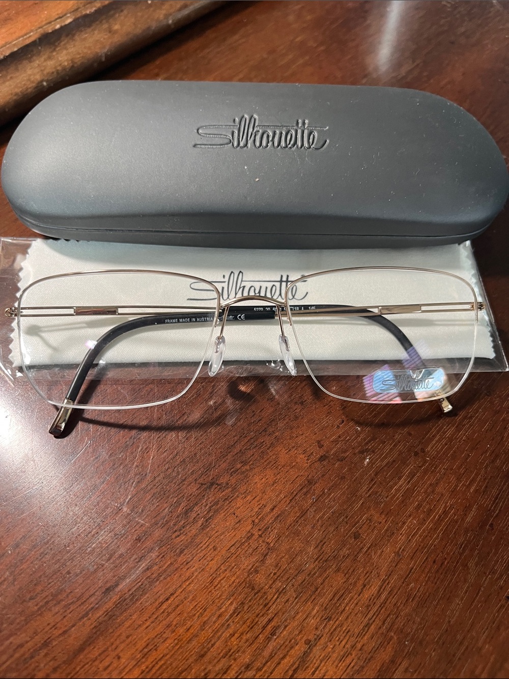 Silhouette 5279 semi Rimless Glasses in shiny Gold with Black Temples